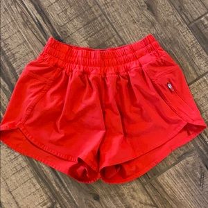 Red lululemon shorts (tracker)
